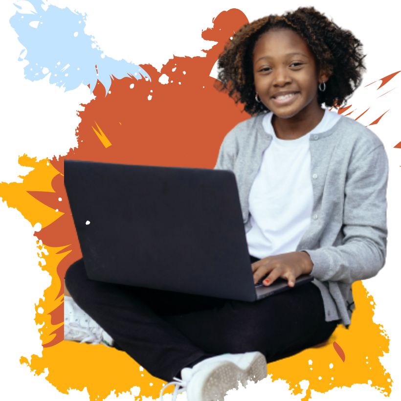 Black kid in front of laptop